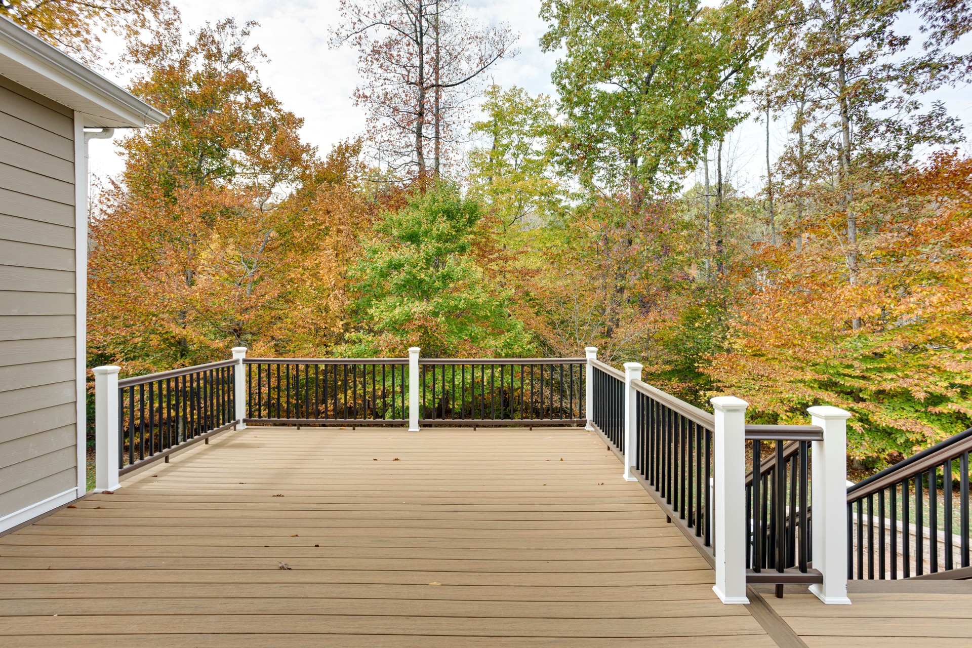 Spacious Wooden Deck Overlooking Autumn Forest View